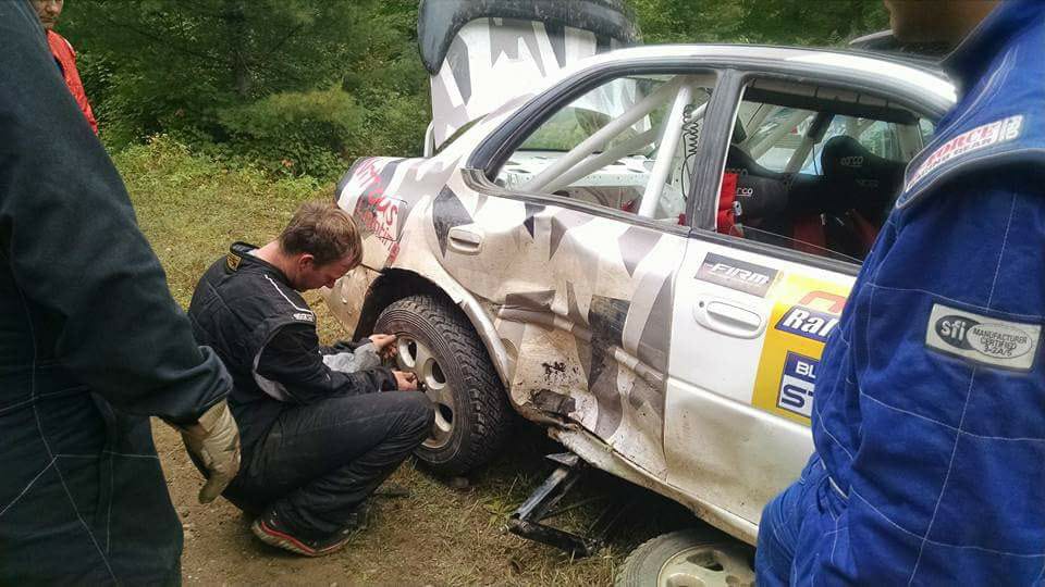 Inspecting Rally Car Damage